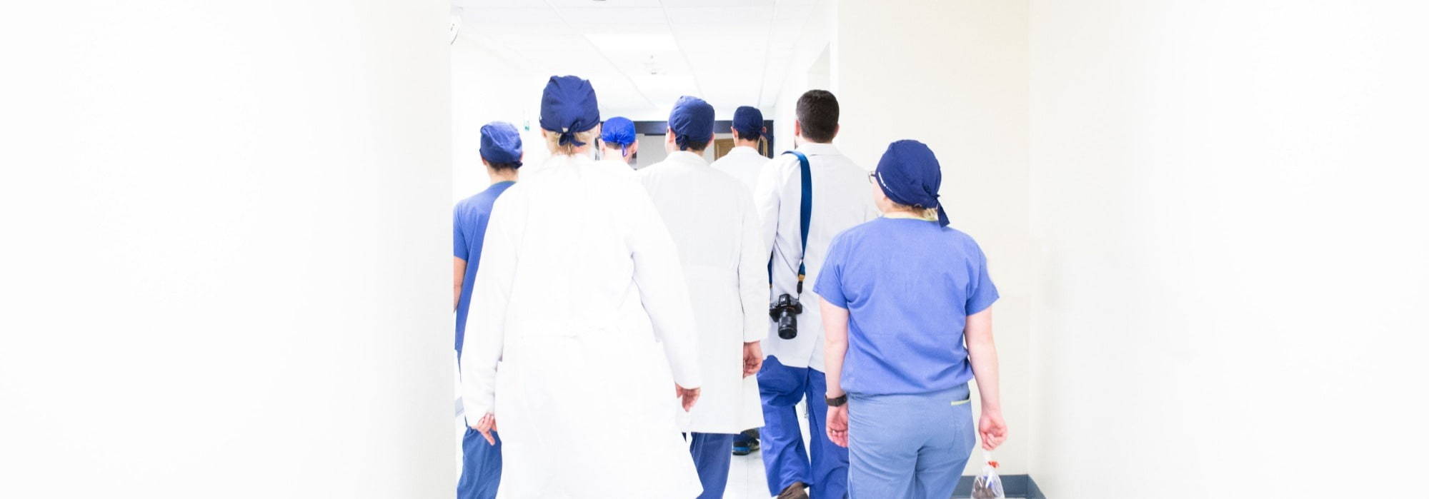 COVID-19 doctors walk down the hallway